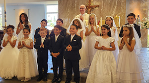 Students celebrating the Sacrament of First Holy Communion