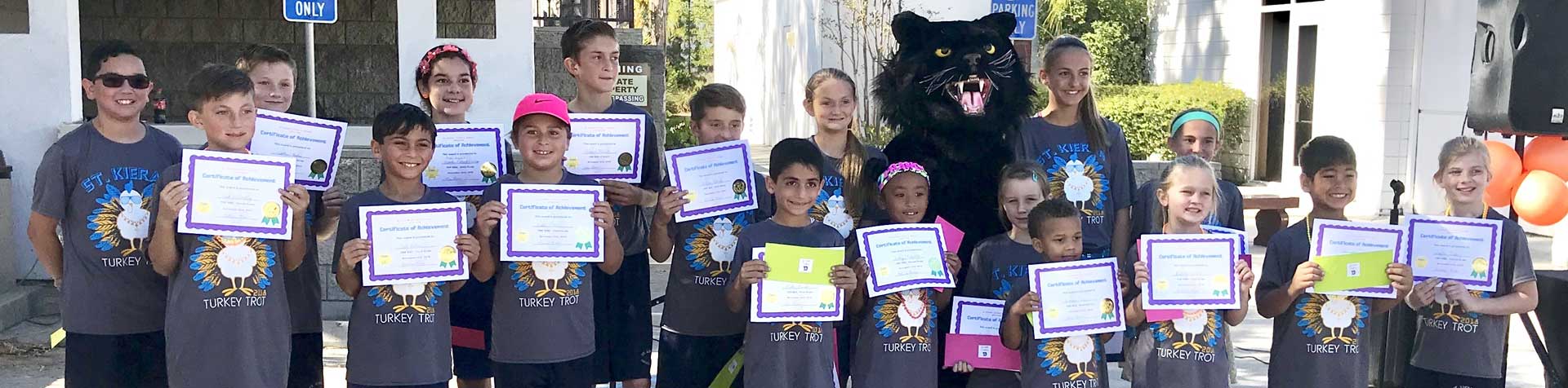 large group of students holding certificates