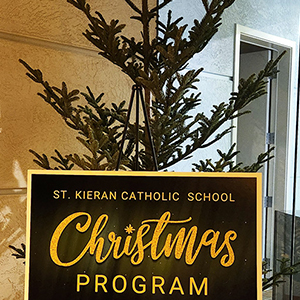 Students holding advent books