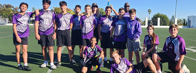 Group of happy students on a soccer field