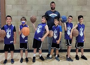 boys basketball team with their coach