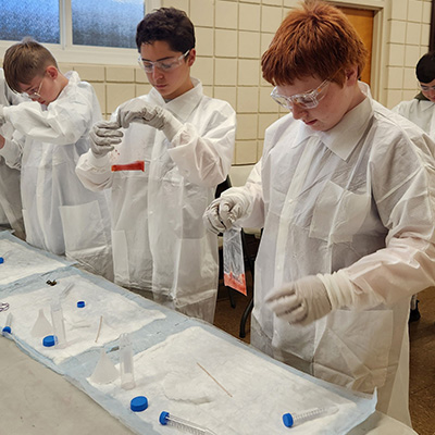 Students examining specimen bags 