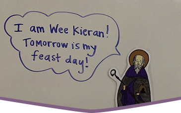 Drawing of a small St. Kieran of Saighir with a speech bubble reading I am Wee Kieran! Tomorrow is my feast day!